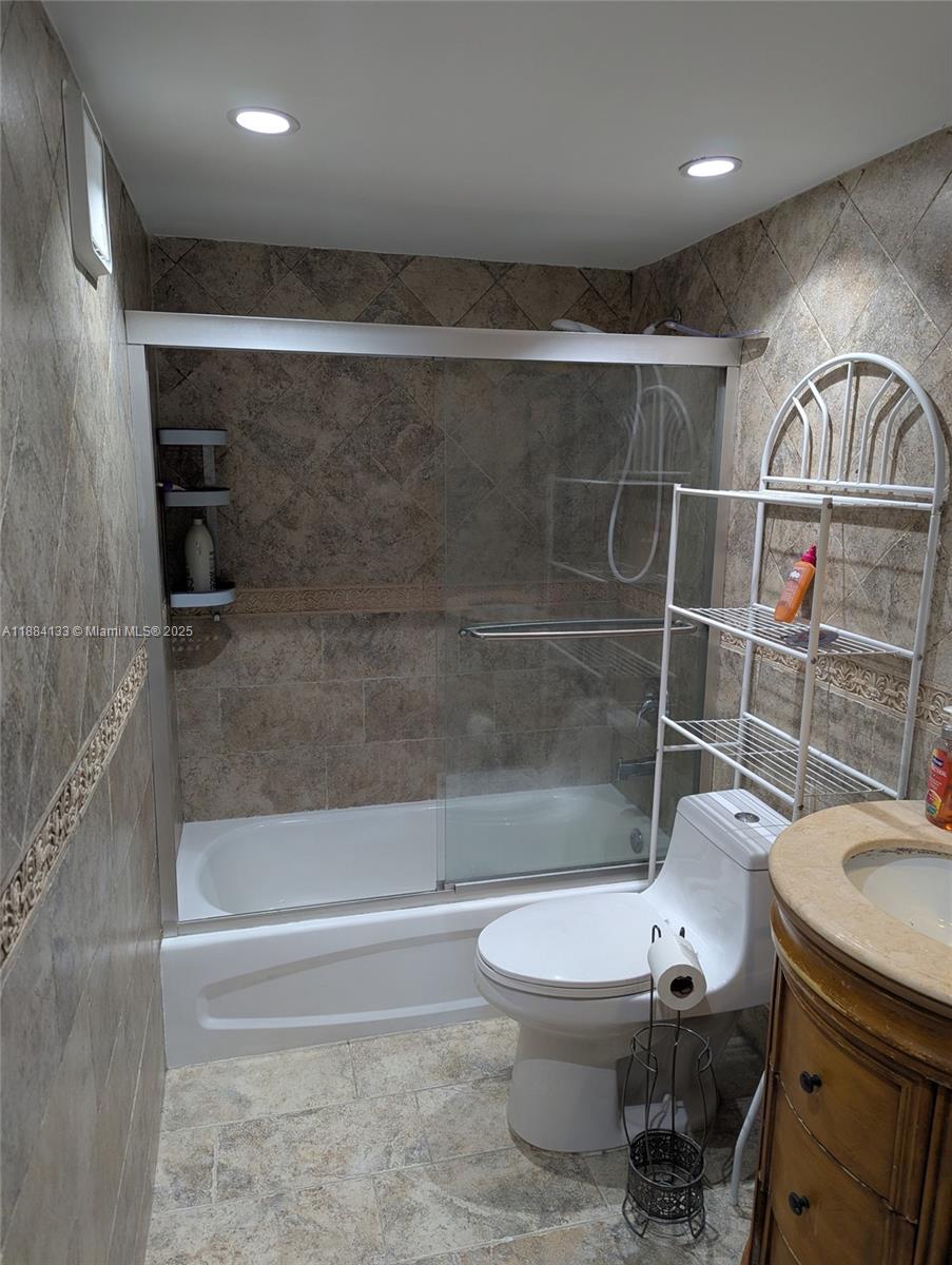 13700 Southwest 62nd Street, Unit 204 Miami, FL 33183 - Photo 19 of 30 a bathroom with a toilet and a shower