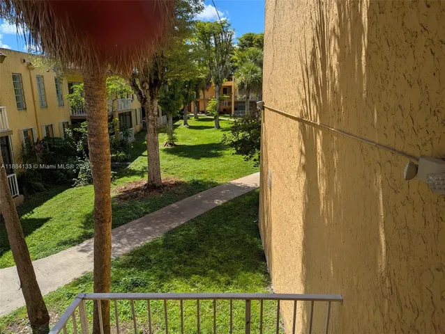 a view of a street with a building in the background