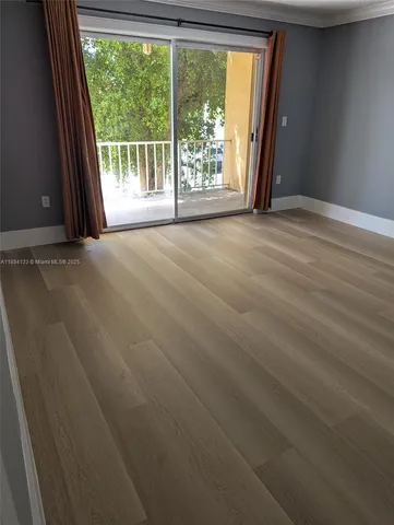 a view of a room with a large window