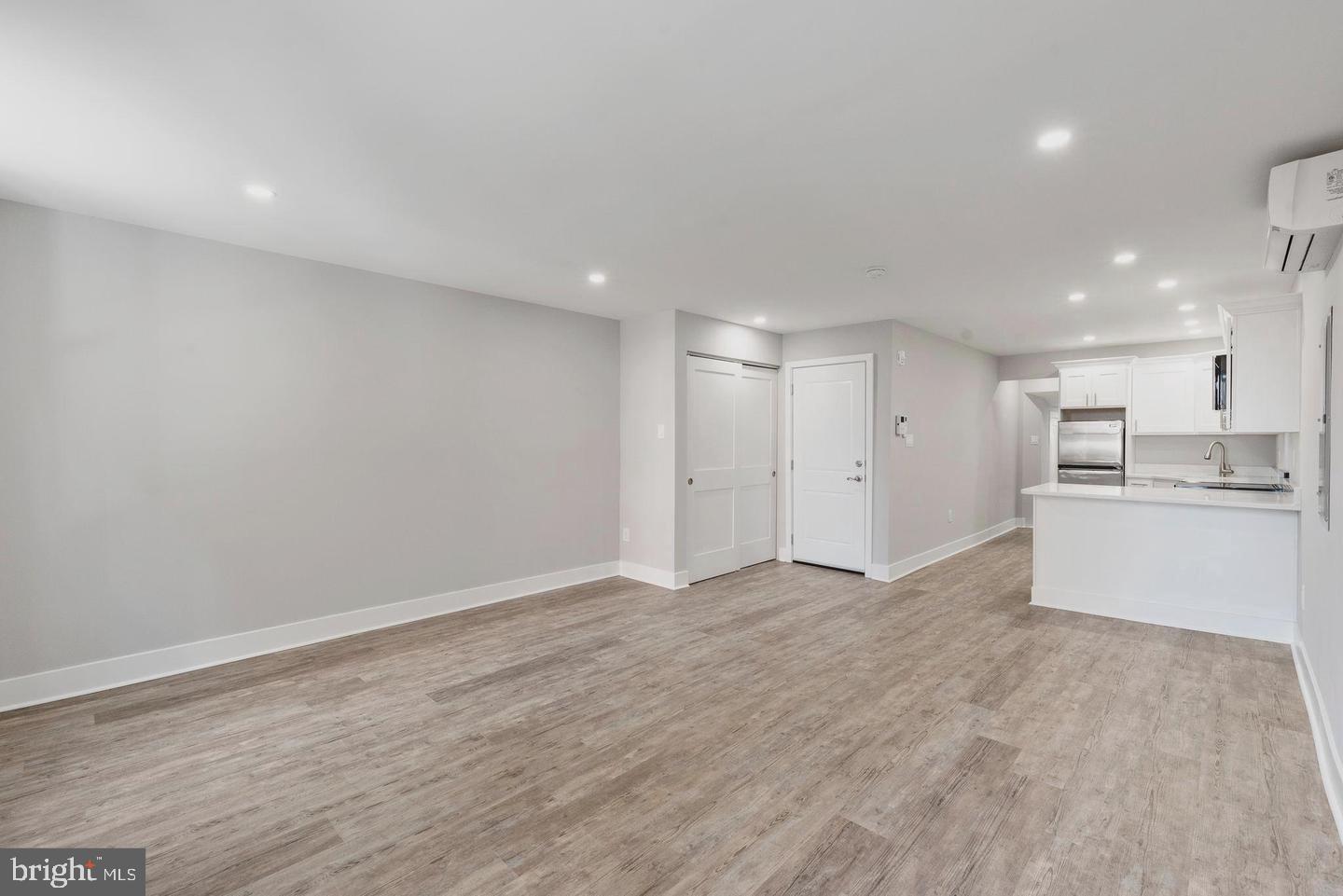 256 South 11th Street, Unit 2 Philadelphia, PA 19107 - Photo 4 of 13 a view of a kitchen with a sink and a refrigerator
