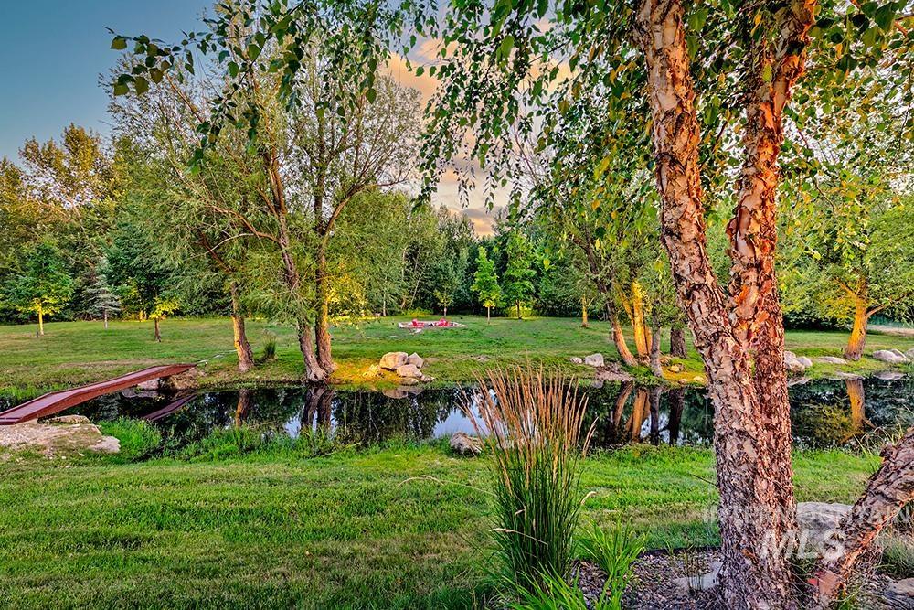 1582 East Rivers End Court Eagle, ID 83616 - Photo 41 of 49 View of grassy yard with a water view