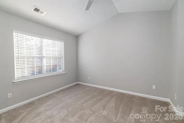 a view of a hallway with a white walls