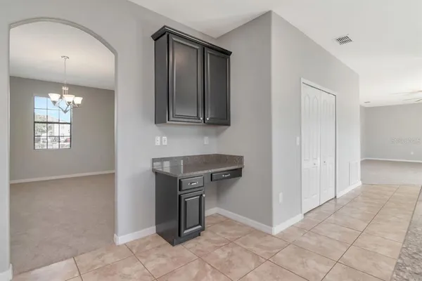 a view of an empty room and fire place