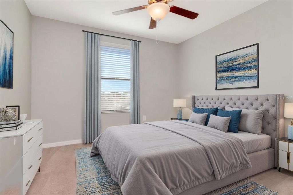 13939 Felix Will Road Riverview, FL 33579 - Photo 28 of 47 a bedroom with a bed and a window