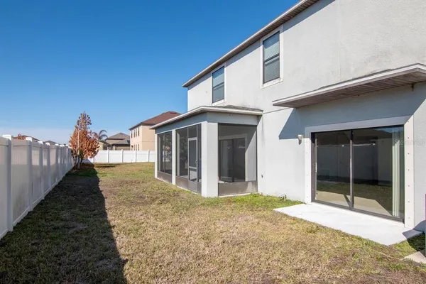 a view of a house with backyard porch