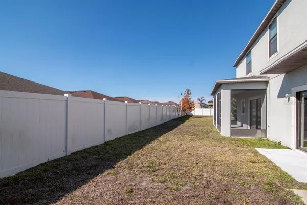 a view of a backyard of the house
