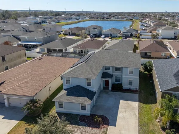 an aerial view of a house with a garden