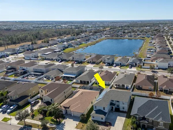 an aerial view of residential houses with outdoor space