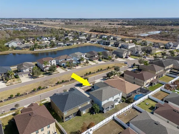 an aerial view of a house with a swimming pool