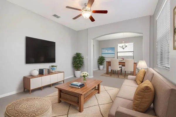 a living room with furniture and a flat screen tv