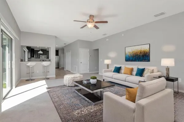 a living room with furniture and view of living room