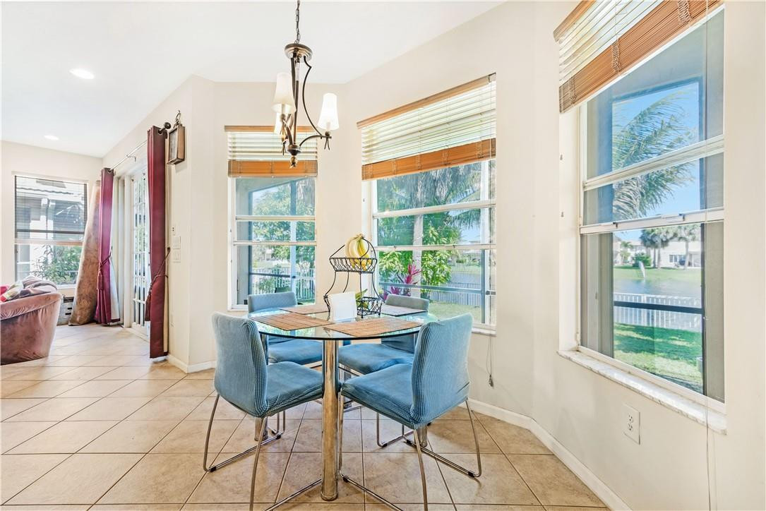 4611 Southwest 131st Terrace Miramar, FL 33027 - Photo 11 of 66 a dining room with furniture and window