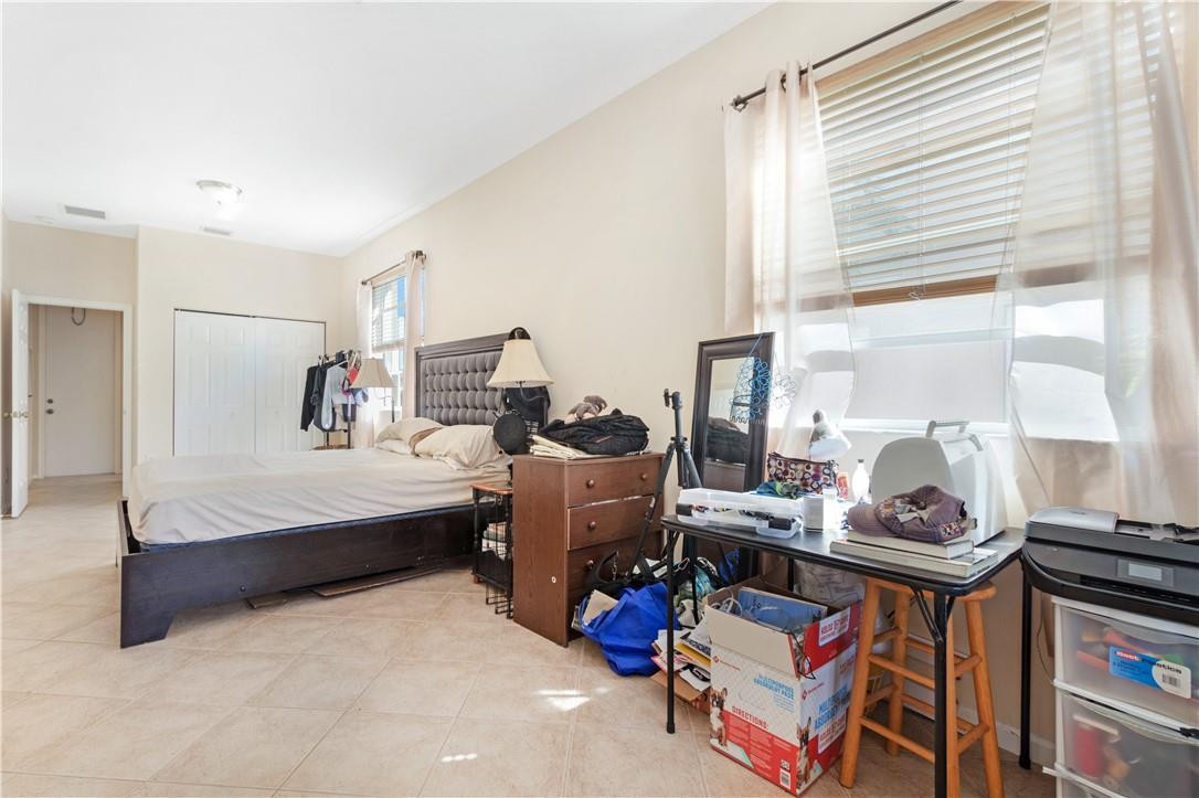 4611 Southwest 131st Terrace Miramar, FL 33027 - Photo 15 of 66 a bedroom with furniture and a window
