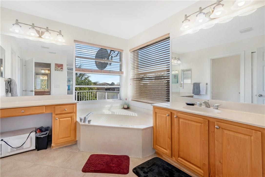 4611 Southwest 131st Terrace Miramar, FL 33027 - Photo 19 of 66 a bathroom with a sink double vanity and a mirror