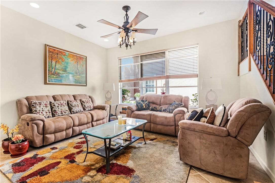 4611 Southwest 131st Terrace Miramar, FL 33027 - Photo 2 of 66 a living room with furniture ceiling fan and a window