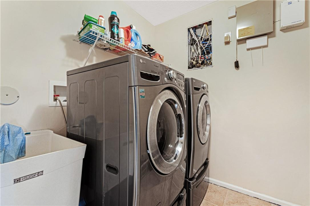 4611 Southwest 131st Terrace Miramar, FL 33027 - Photo 26 of 66 a utility room with dryer and washer