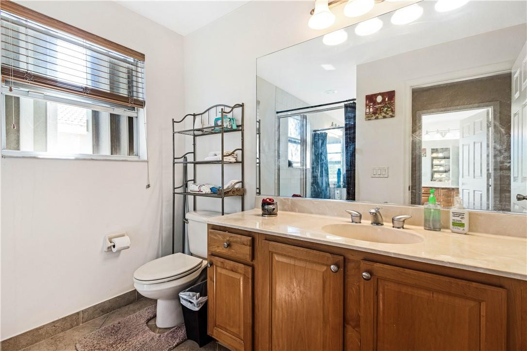 4611 Southwest 131st Terrace Miramar, FL 33027 - Photo 29 of 66 a bathroom with a sink toilet and window