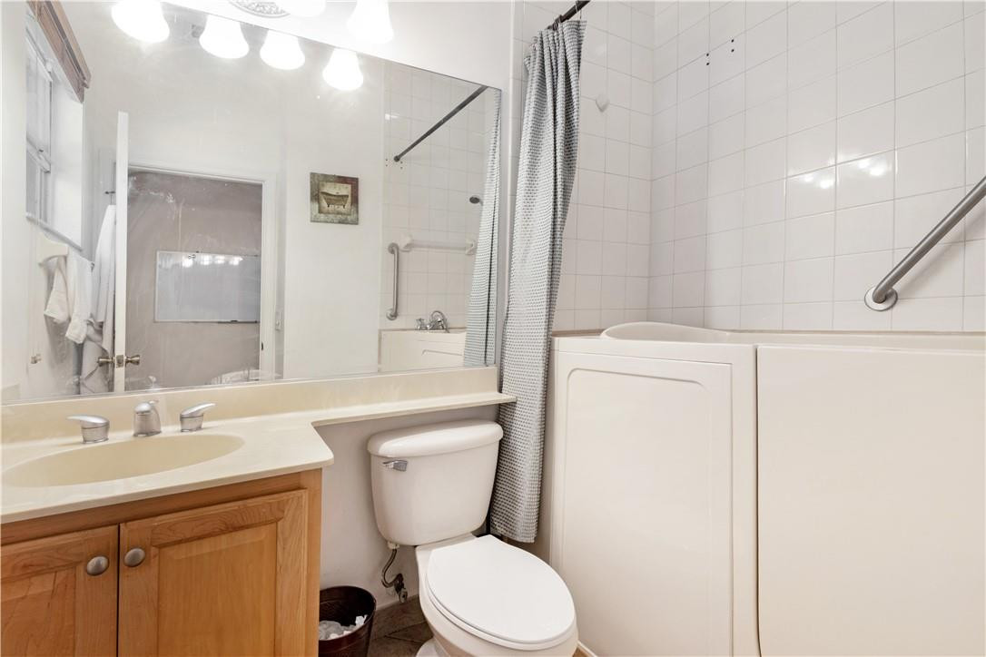 4611 Southwest 131st Terrace Miramar, FL 33027 - Photo 34 of 66 a bathroom with a toilet a sink and a mirror