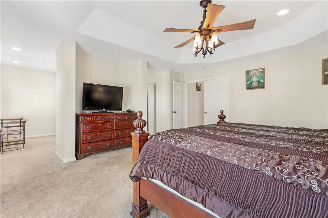4611 Southwest 131st Terrace Miramar, FL 33027 - Photo 35 of 66 a bedroom with a bed and a flat screen tv