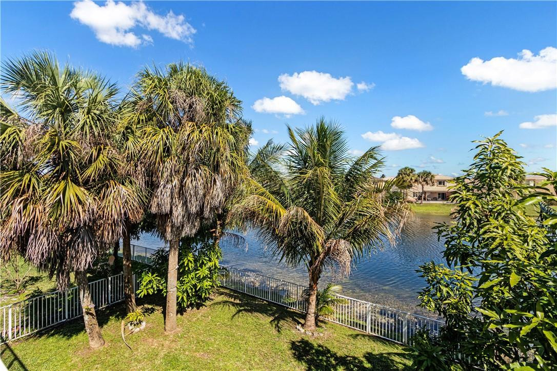 4611 Southwest 131st Terrace Miramar, FL 33027 - Photo 38 of 66 a view of a lake with a building in the background