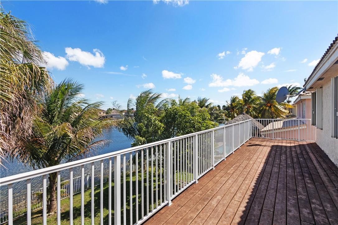 4611 Southwest 131st Terrace Miramar, FL 33027 - Photo 39 of 66 a view of balcony with wooden floor and fence