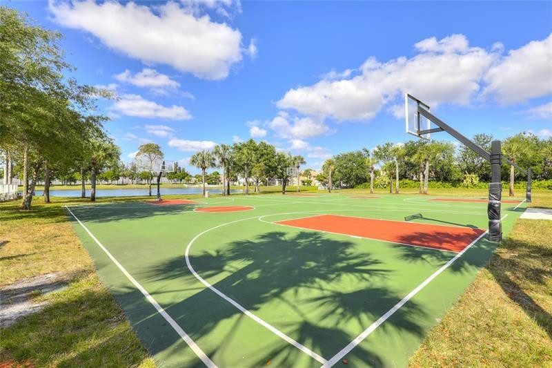 4611 Southwest 131st Terrace Miramar, FL 33027 - Photo 59 of 66 a view of a tennis ground with large trees