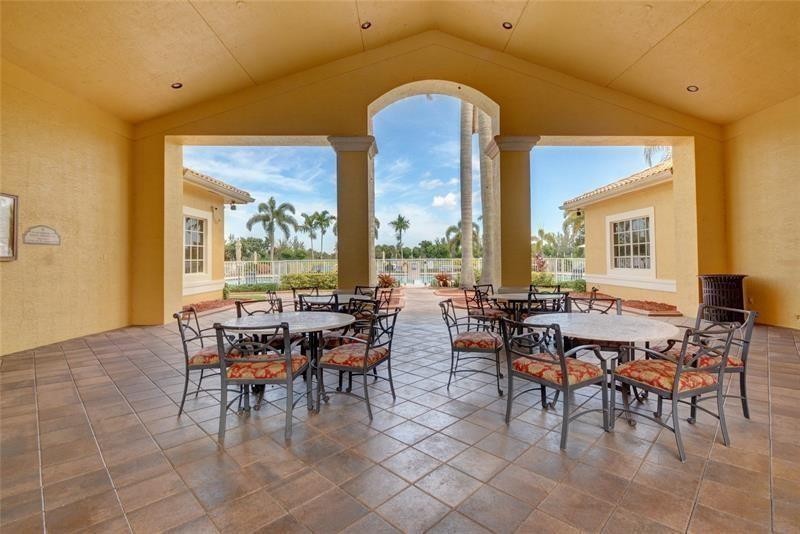 4611 Southwest 131st Terrace Miramar, FL 33027 - Photo 61 of 66 a view of a dining room with furniture window and outside view