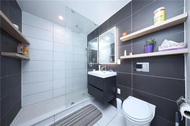 a bathroom with a toilet a sink and bathtub