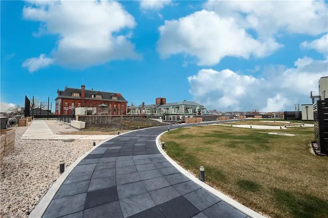 a view of a swimming pool with a yard