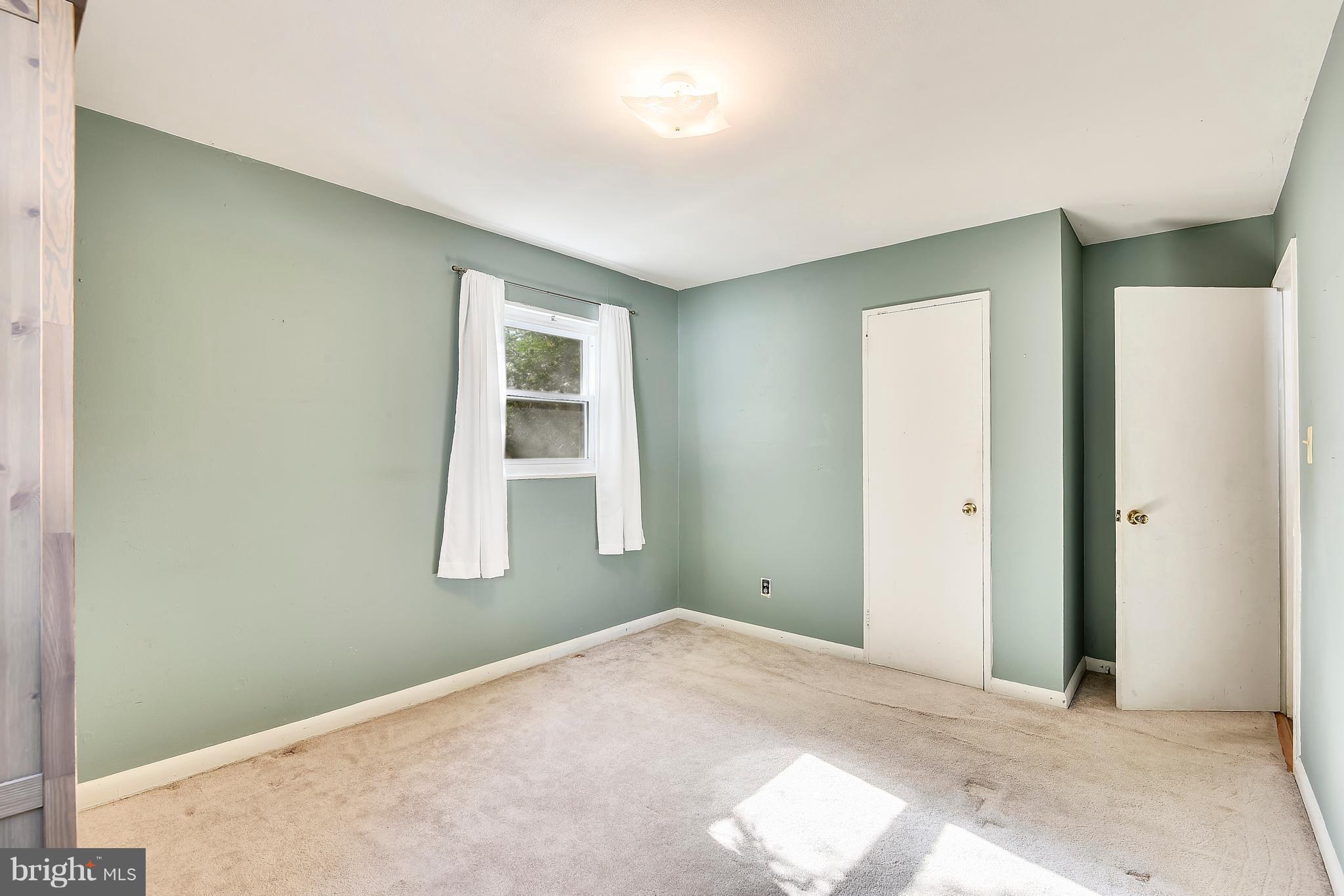 3006 Weller Road Silver Spring, MD 20906 - Photo 11 of 18 a view of an empty room with a window