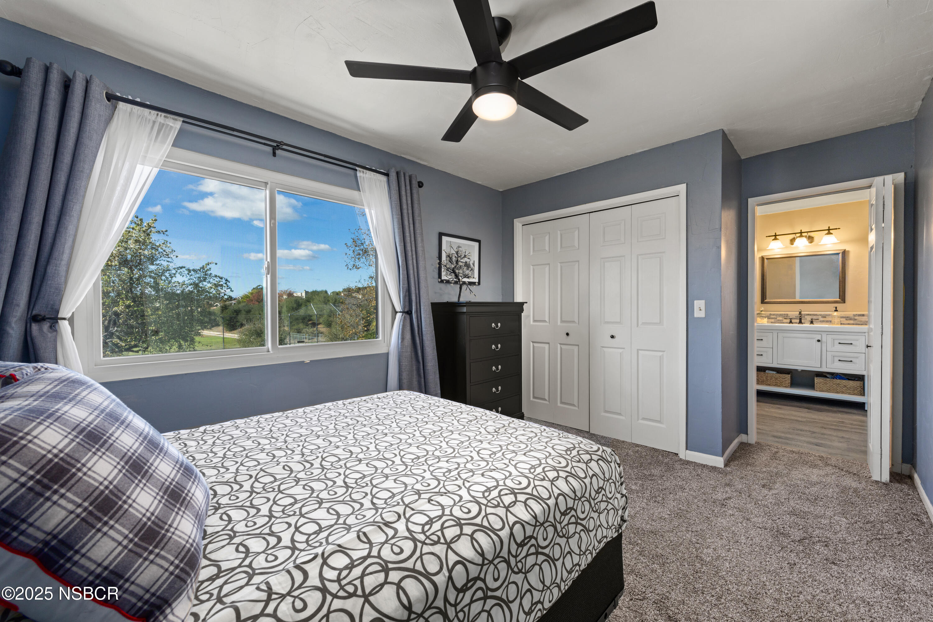 639 Roskilde Road Solvang, CA 93463 - Photo 18 of 27 a bedroom with a bed and a large window
