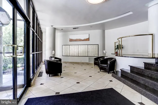 a living room with hard wood floors and a wooden floors