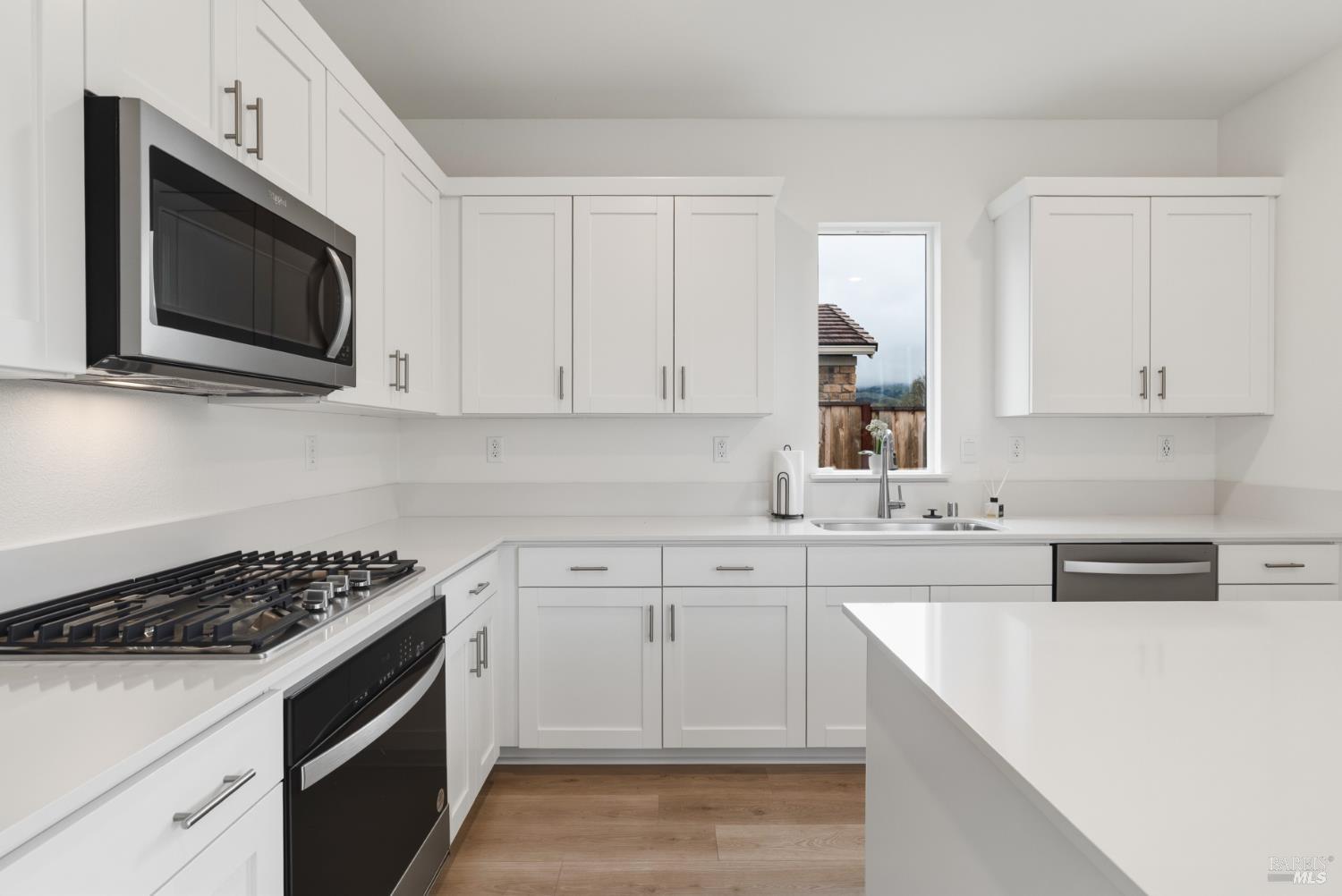 2158 Owens Place Rohnert Park, CA 94928 - Photo 11 of 28 a kitchen with cabinets appliances and a sink