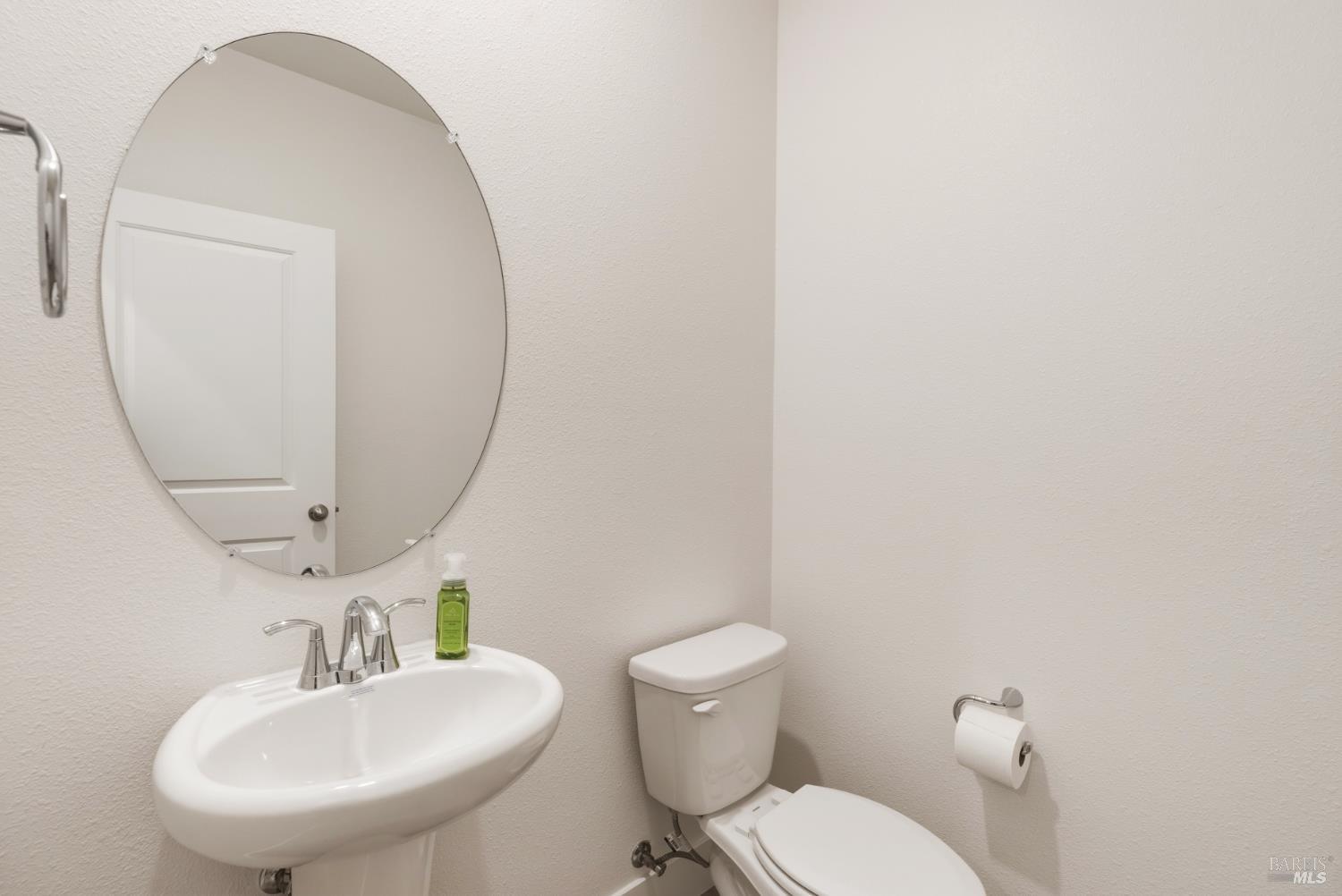 2158 Owens Place Rohnert Park, CA 94928 - Photo 17 of 28 a bathroom with a toilet a sink and mirror