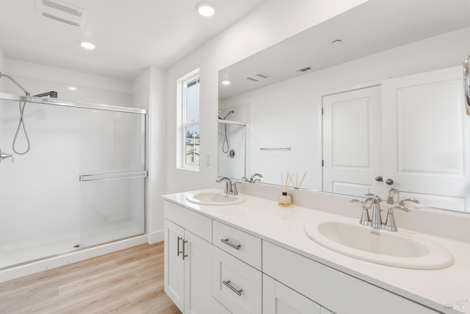 2158 Owens Place Rohnert Park, CA 94928 - Photo 18 of 28 a bathroom with double sink and a mirror