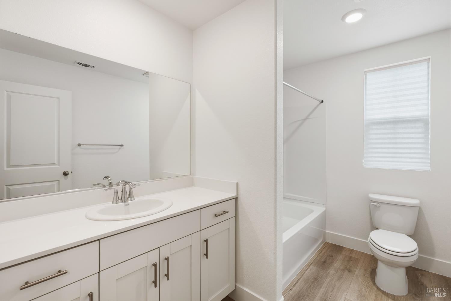 2158 Owens Place Rohnert Park, CA 94928 - Photo 19 of 28 a bathroom with a sink a toilet and shower