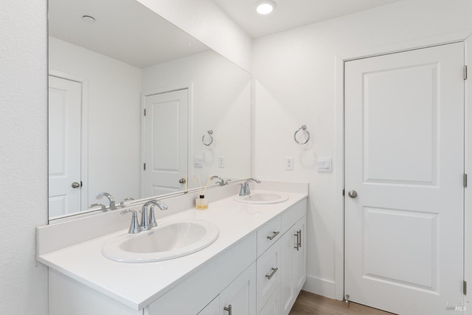 2158 Owens Place Rohnert Park, CA 94928 - Photo 23 of 28 a bathroom with double sink and a mirror