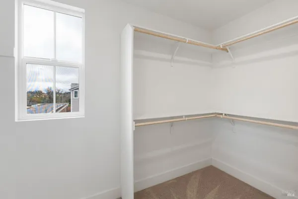 a view of an empty walk in closet