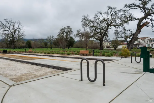 a view of outdoor space with seating area and trees around