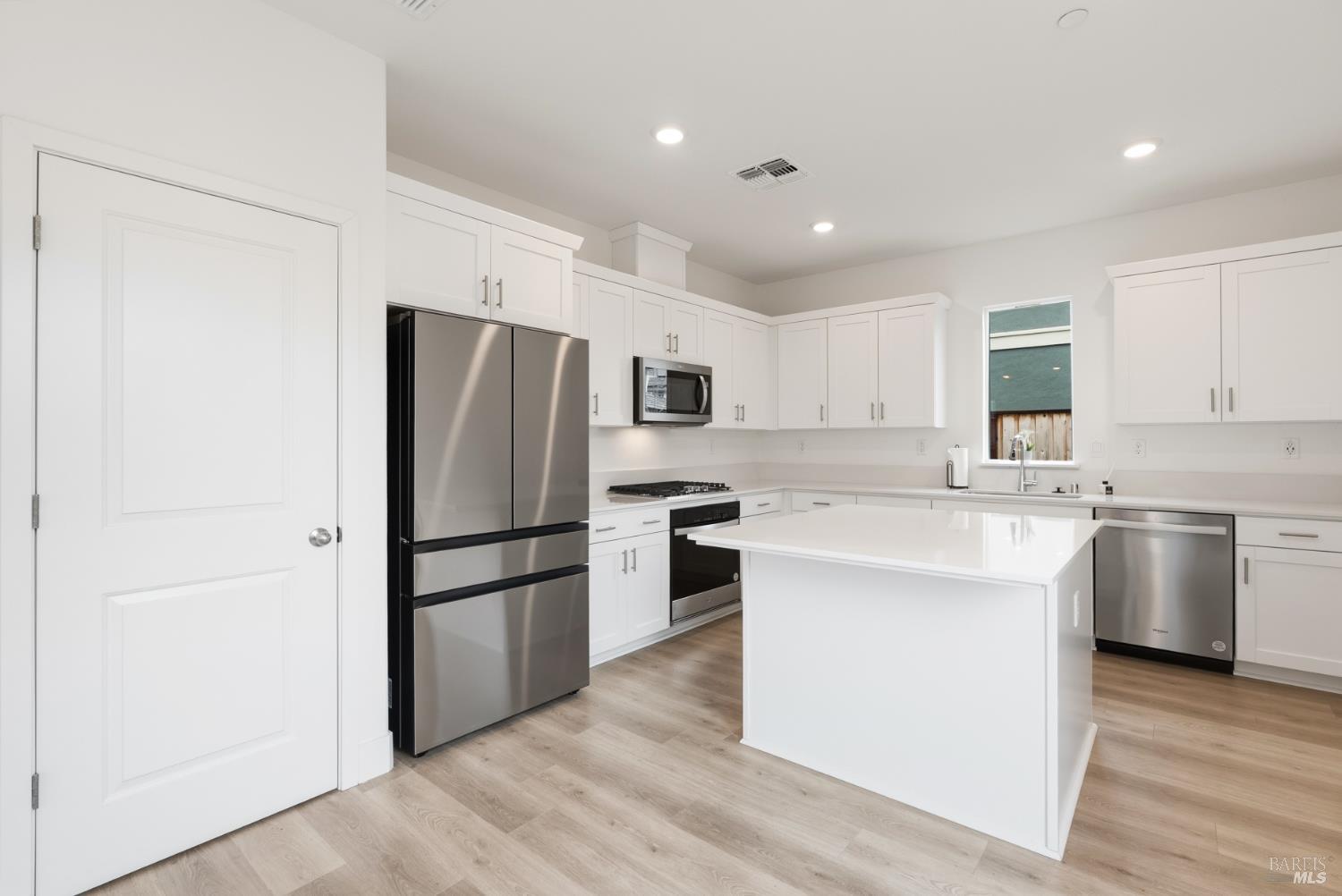 2158 Owens Place Rohnert Park, CA 94928 - Photo 9 of 28 a kitchen with a refrigerator sink and cabinets