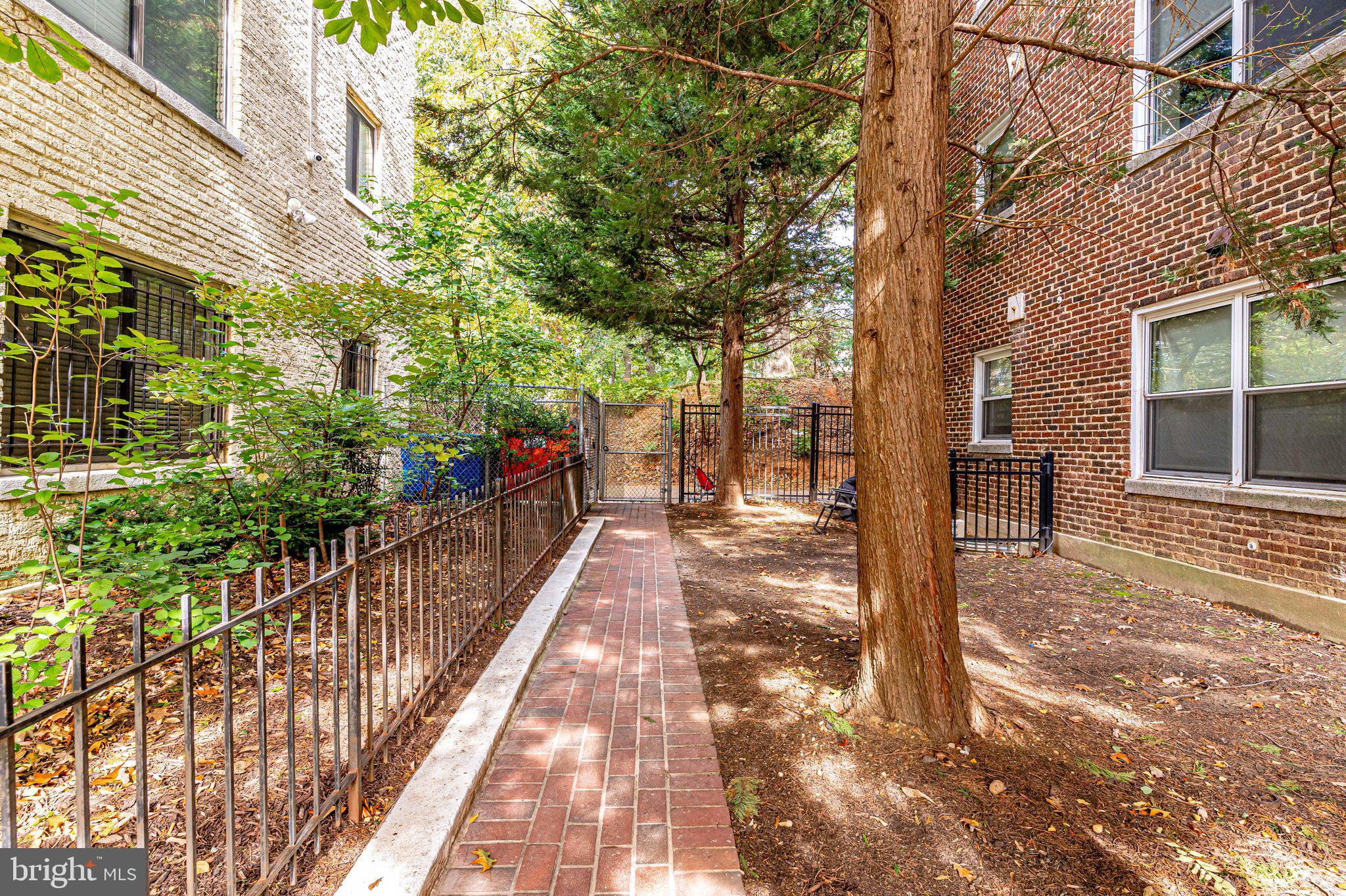 1437 Spring Road Northwest, Unit 21 Washington, DC 20010 - Photo 26 of 28 Lead Walkway to Alley Way
