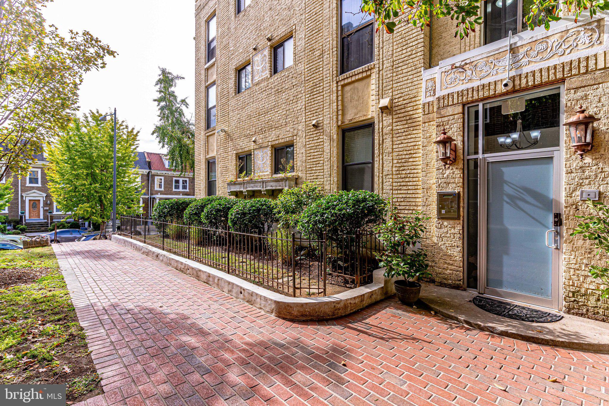 1437 Spring Road Northwest, Unit 21 Washington, DC 20010 - Photo 3 of 28 Sidewalk View to Main Entrance Front Door