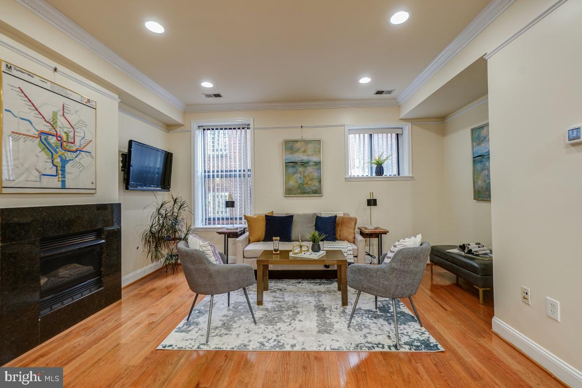 1437 Spring Road Northwest, Unit 21 Washington, DC 20010 - Photo 7 of 28 Living Room with Gas Fireplace