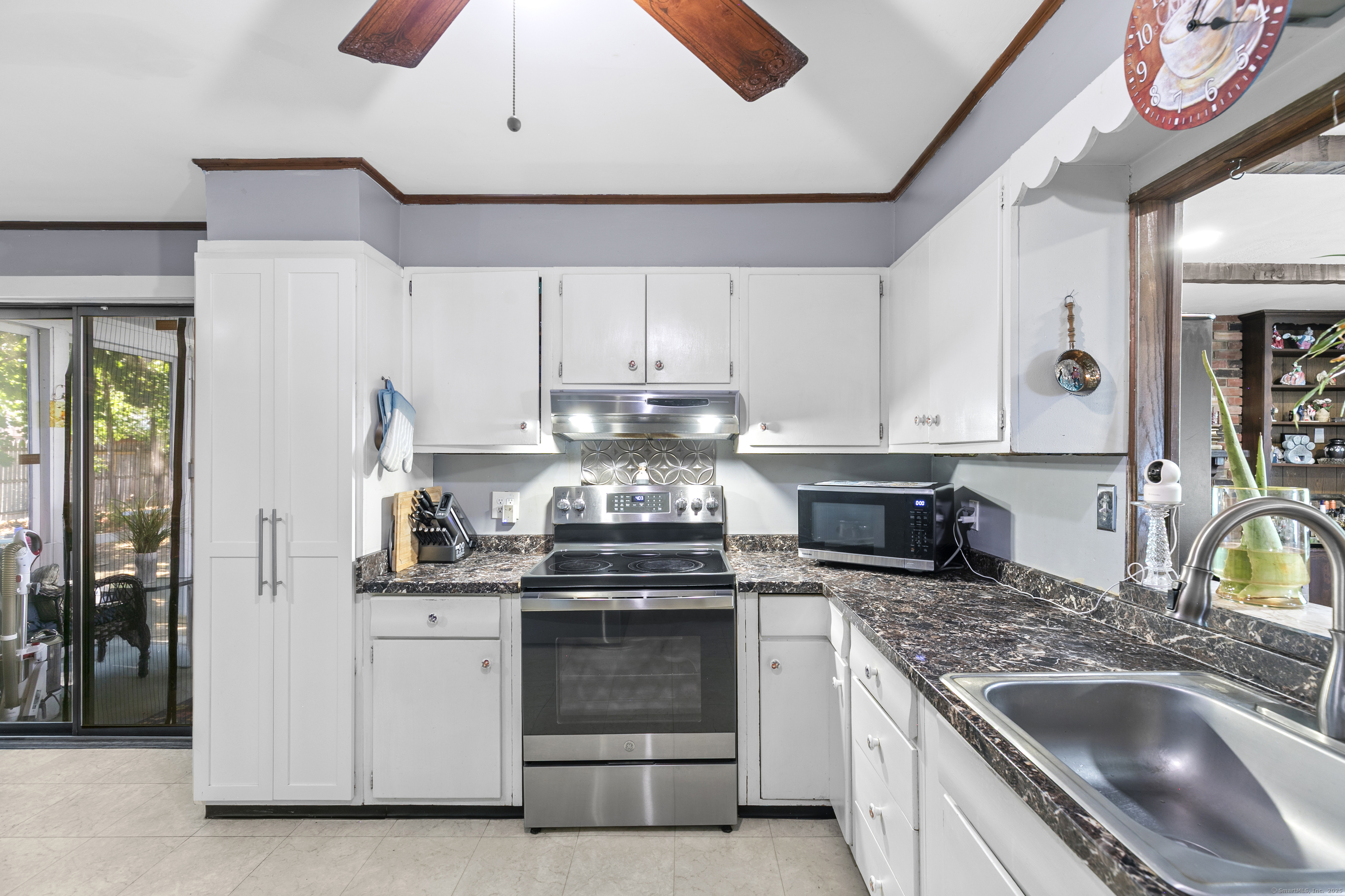 66 Loftus Circle Trumbull, CT 06611 - Photo 16 of 40 a kitchen with stainless steel appliances granite countertop a sink and cabinets