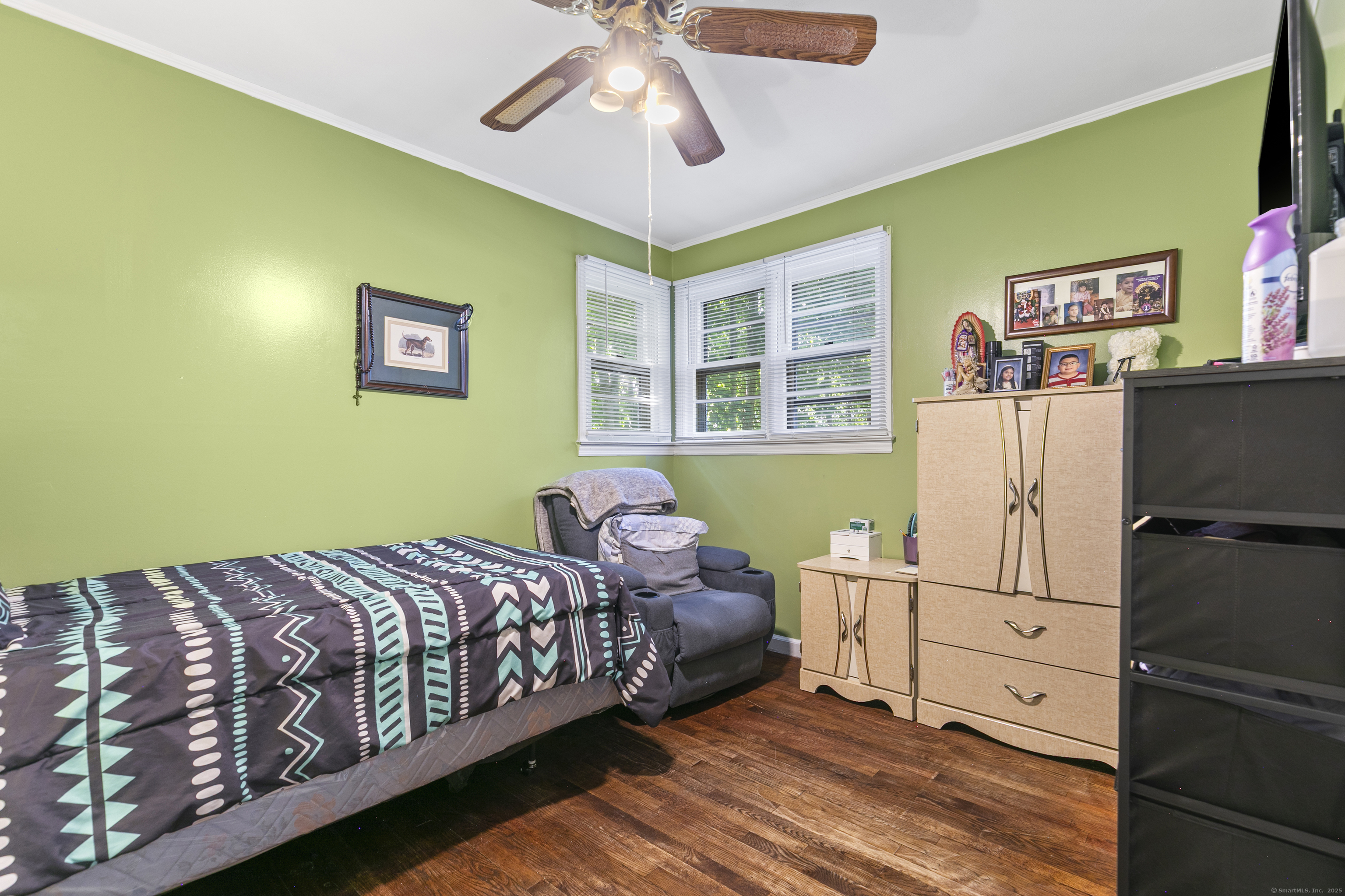 66 Loftus Circle Trumbull, CT 06611 - Photo 20 of 40 a bedroom with a bed and wooden floor