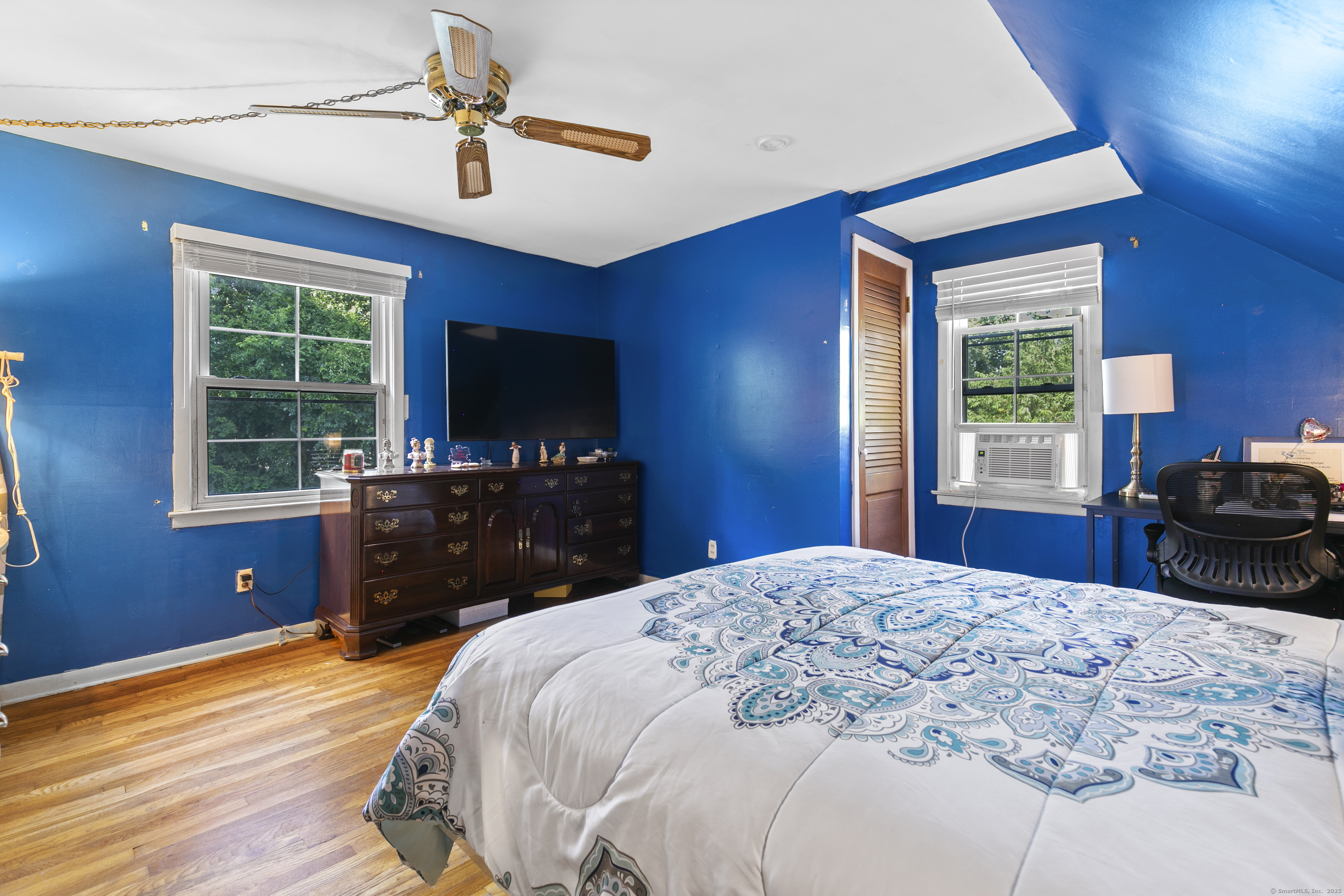66 Loftus Circle Trumbull, CT 06611 - Photo 25 of 40 a bedroom with a bed and a flat screen tv