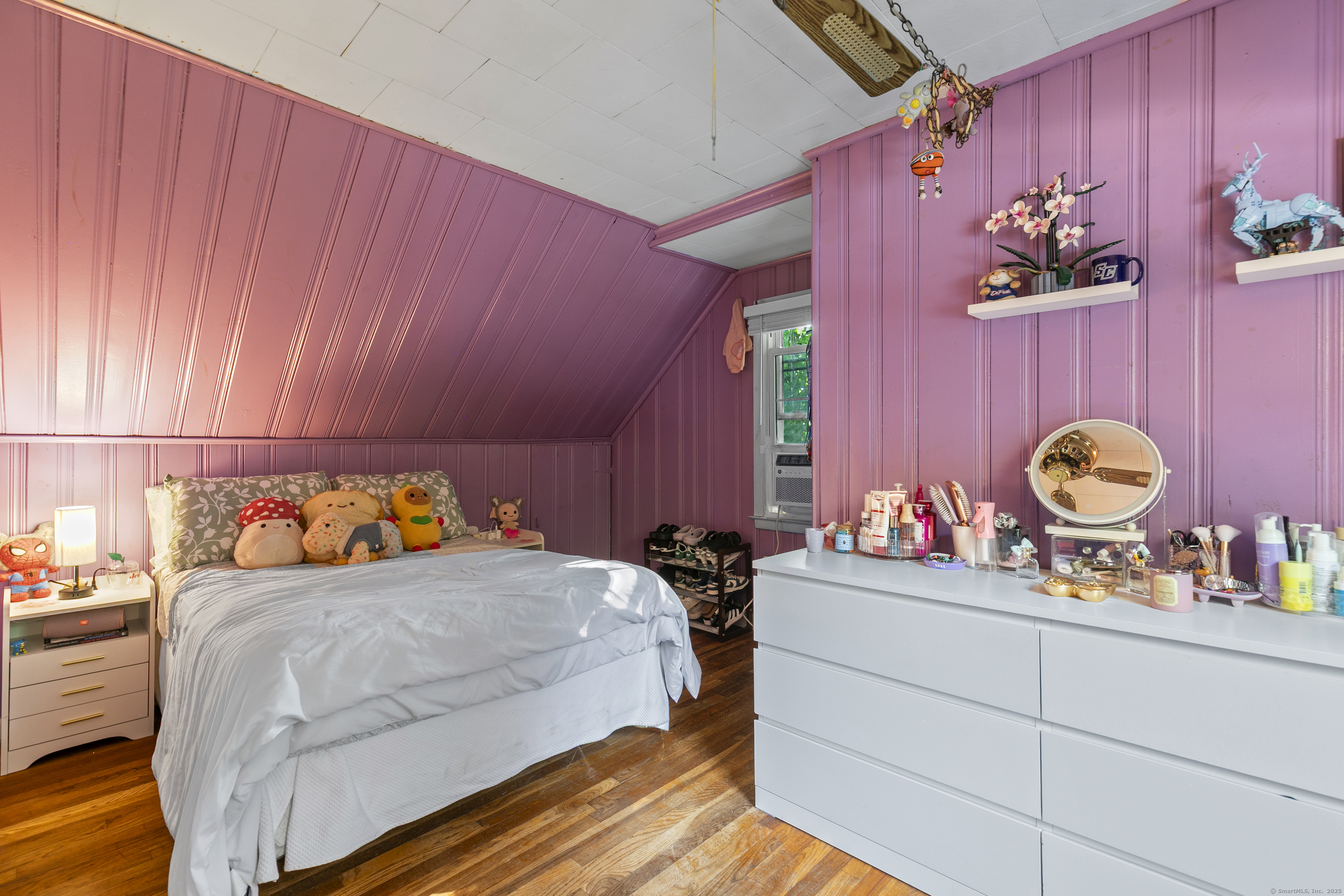 66 Loftus Circle Trumbull, CT 06611 - Photo 27 of 40 a bedroom with a bed and a dresser with mirror