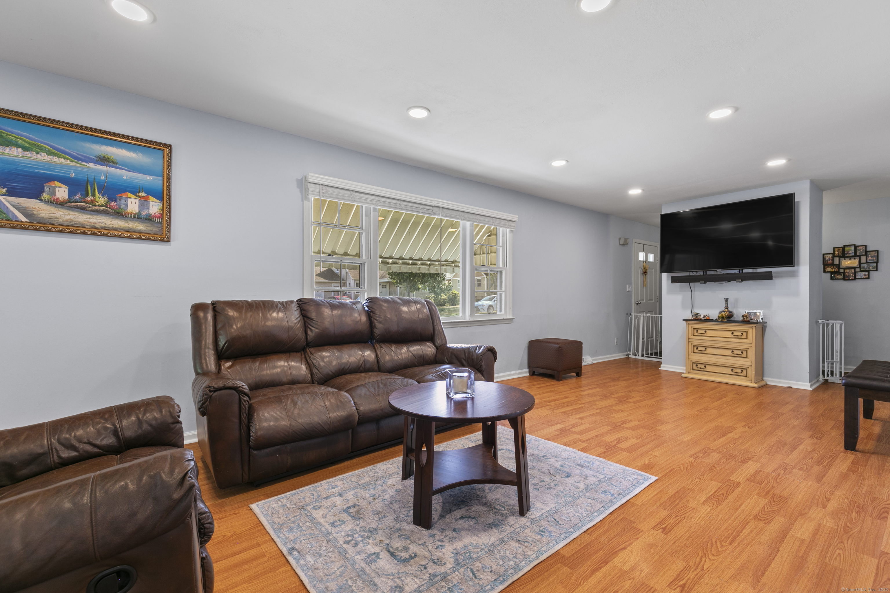 66 Loftus Circle Trumbull, CT 06611 - Photo 3 of 40 a living room with furniture and a flat screen tv