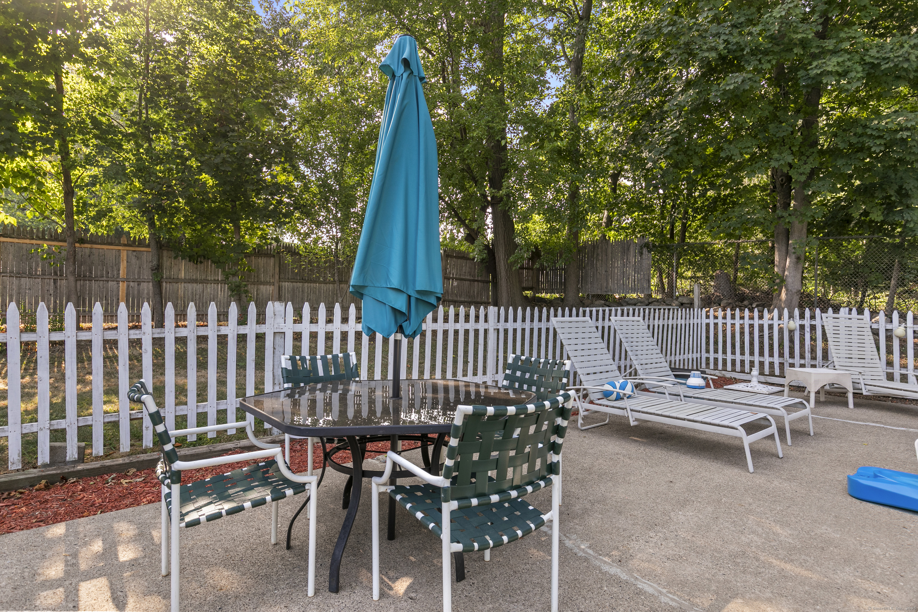 66 Loftus Circle Trumbull, CT 06611 - Photo 38 of 40 a view of a chair and tables in the patio