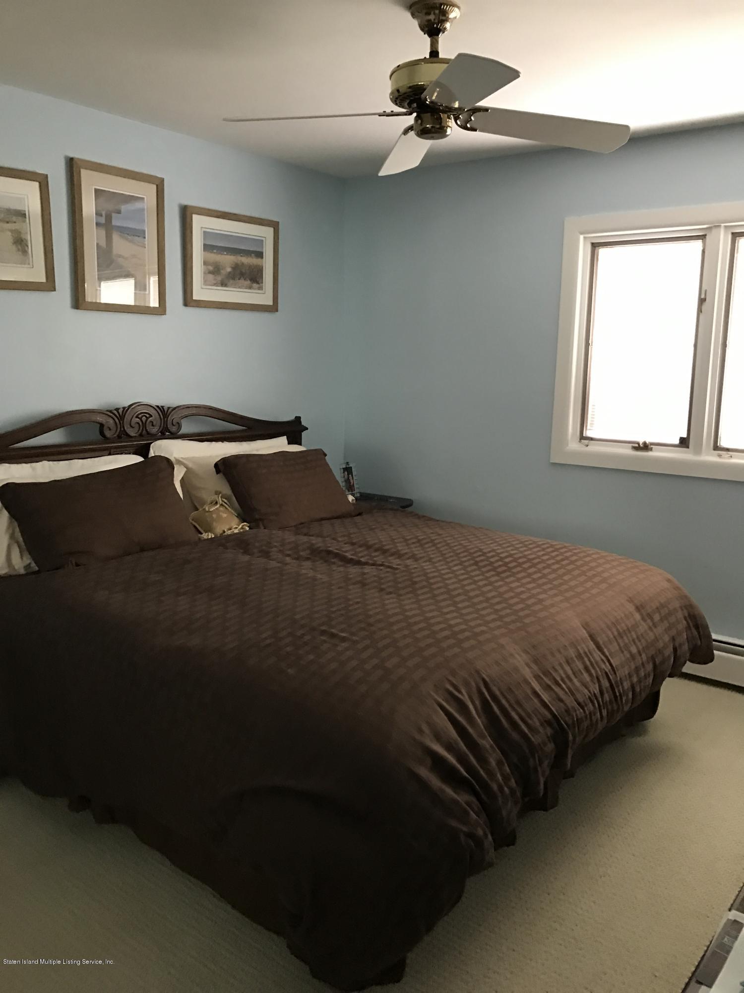 80 Rathbun Avenue Staten Island, NY 10312 - Photo 11 of 21 a bedroom with a bed and window